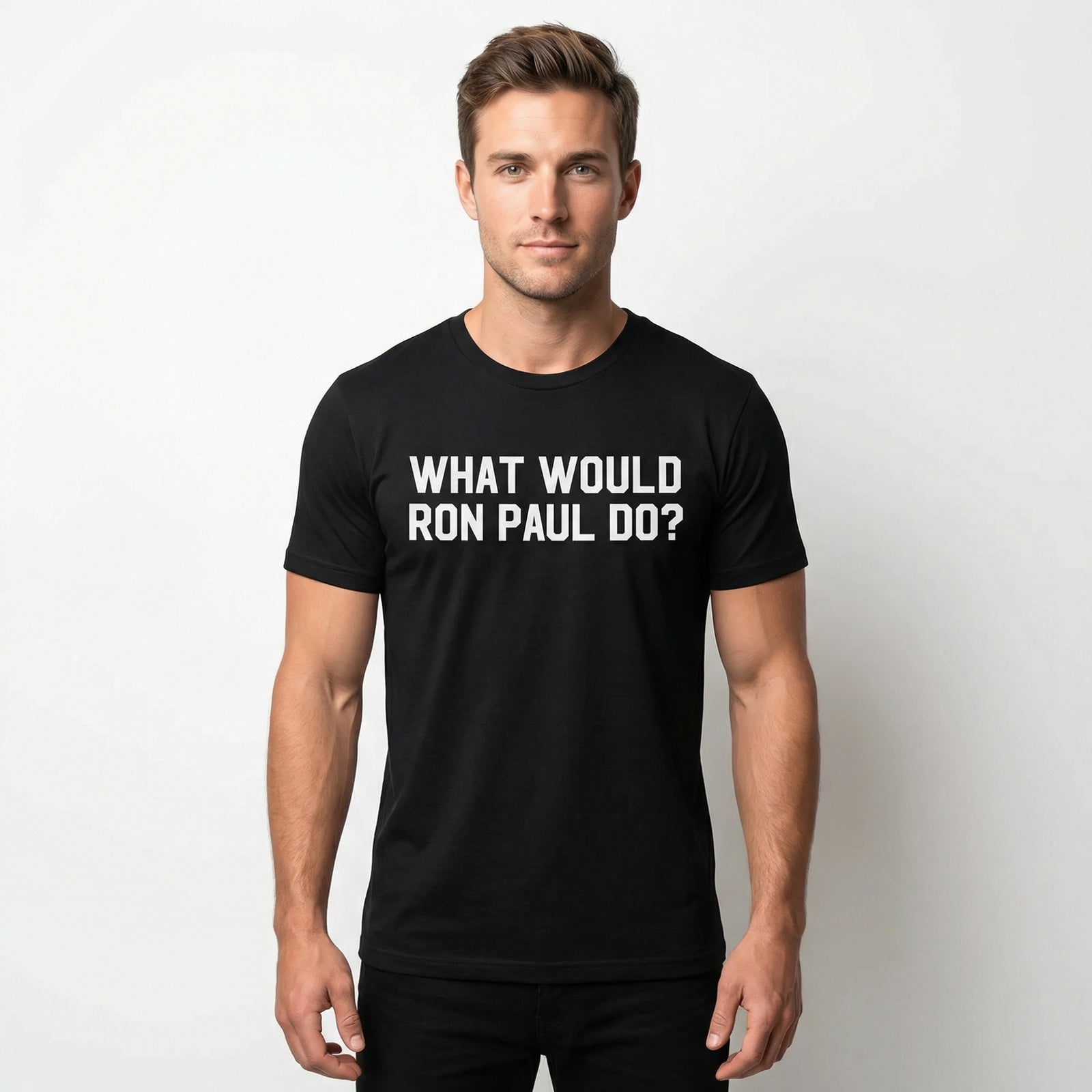 Man wearing a black t-shirt with 'What Would Ron Paul Do?' text on a plain background