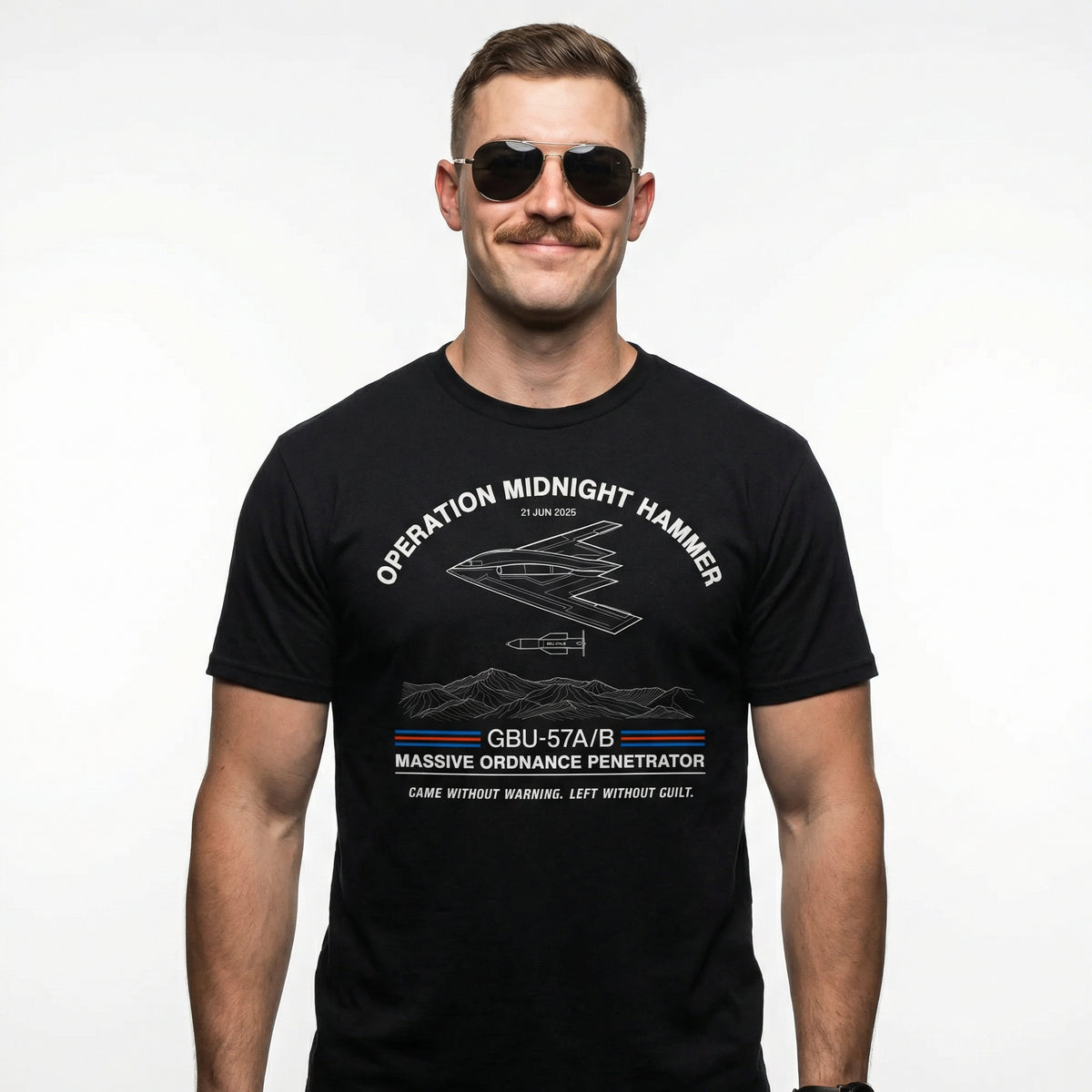 Man wearing a black Operation Midnight Hammer T-Shirt with military-themed graphics and text.