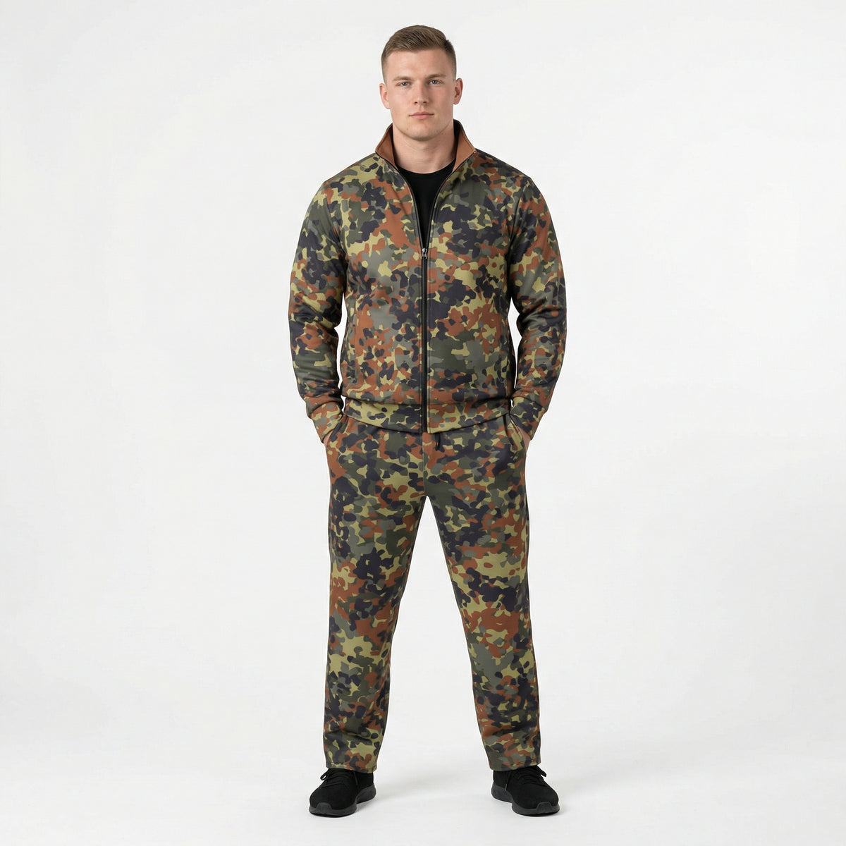 Man wearing a camouflage tracksuit on a white background