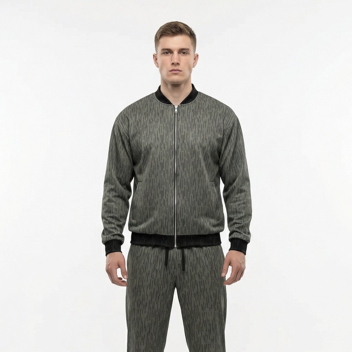 Man wearing a gray tracksuit on a white background