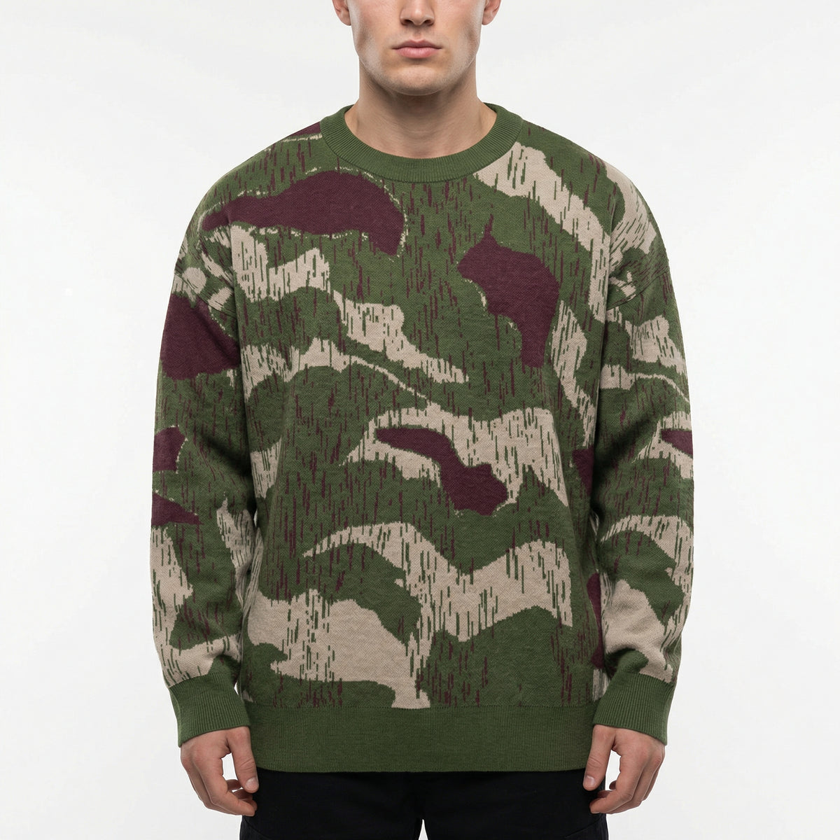 Person wearing a camouflage sweater on a white background