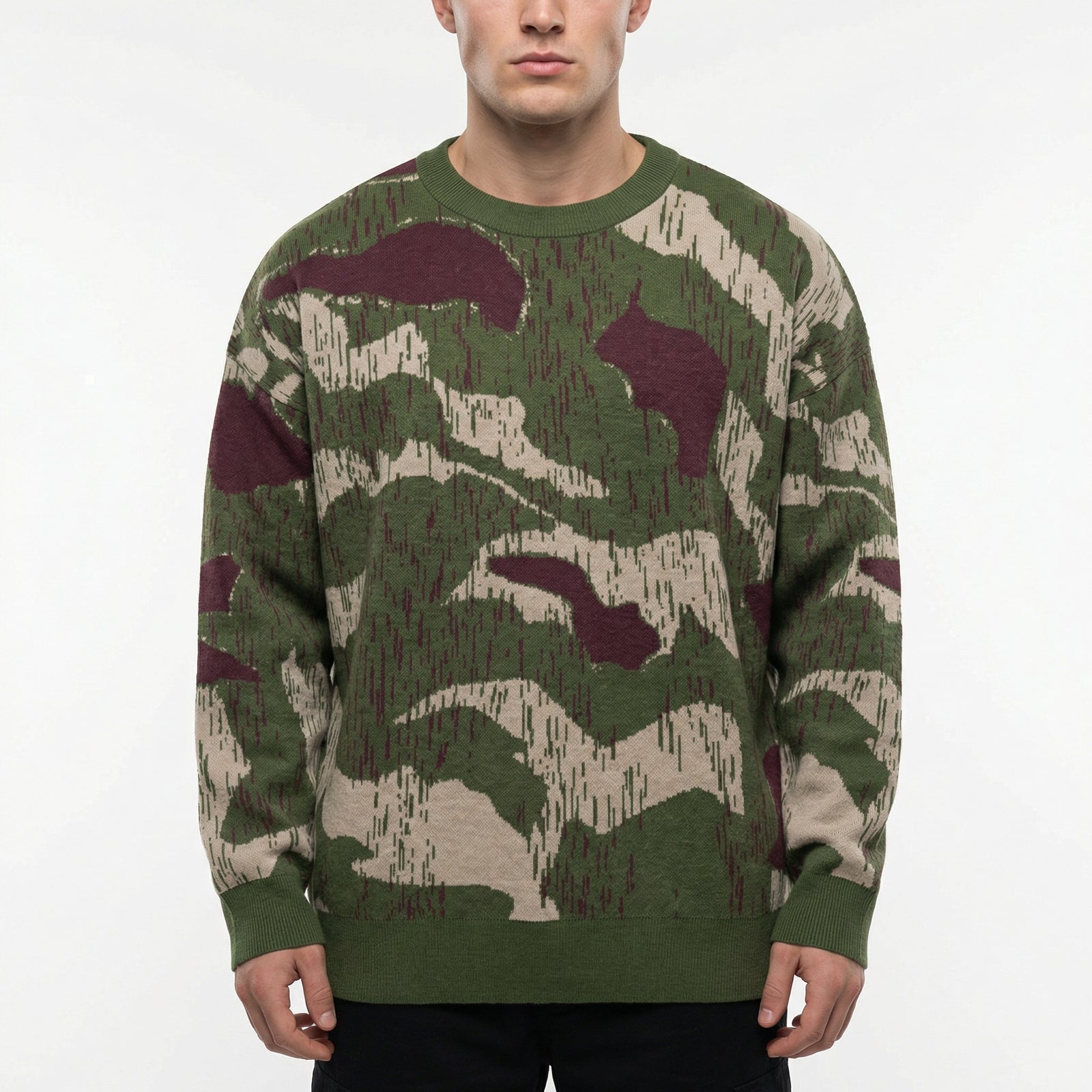 Person wearing a camouflage sweater on a white background