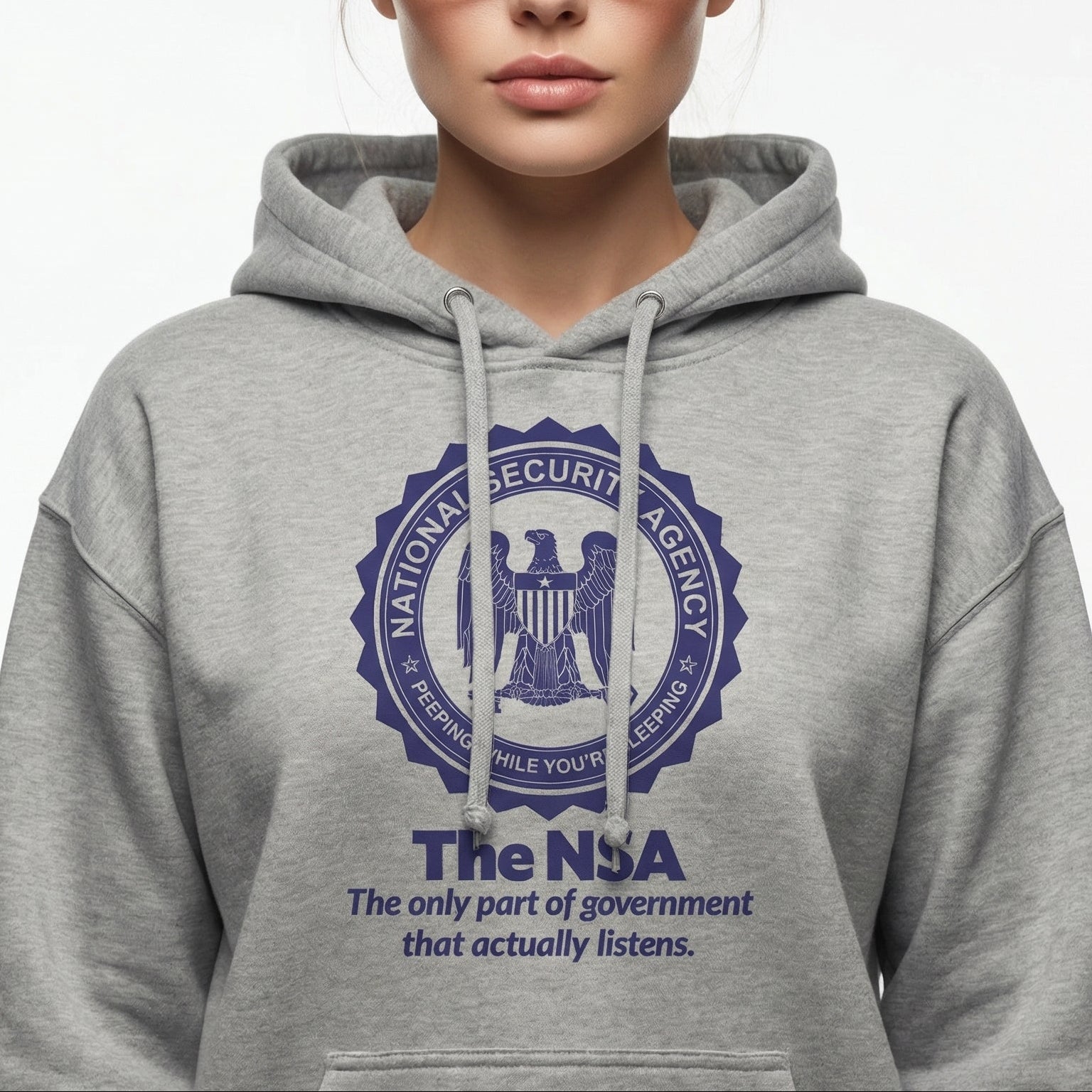 Person wearing a gray hoodie with NSA logo and text on a white background