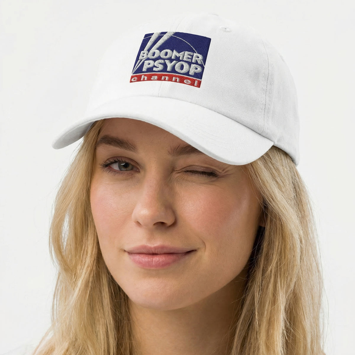 Person wearing a white cap with 'Boomer PSYOP Channel' logo on a white background