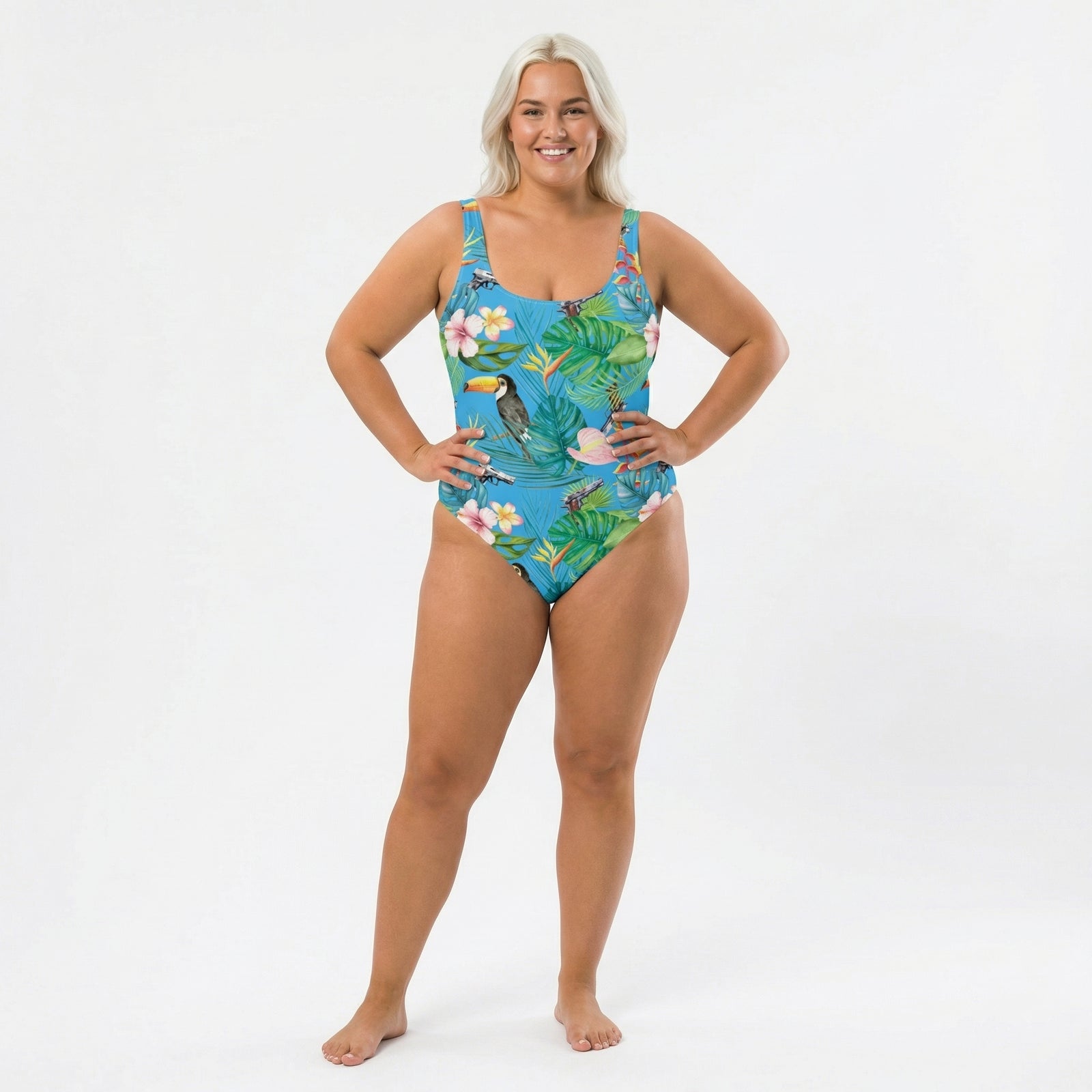 Woman wearing a tropical print swimsuit on a white background