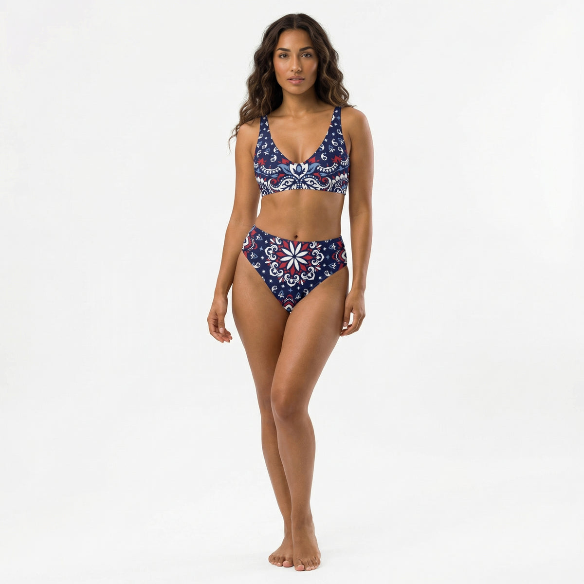 Woman wearing a blue patterned bikini set on a white background