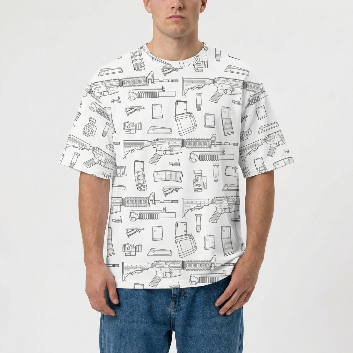 Person wearing a white t-shirt with black line art patterns on a plain background