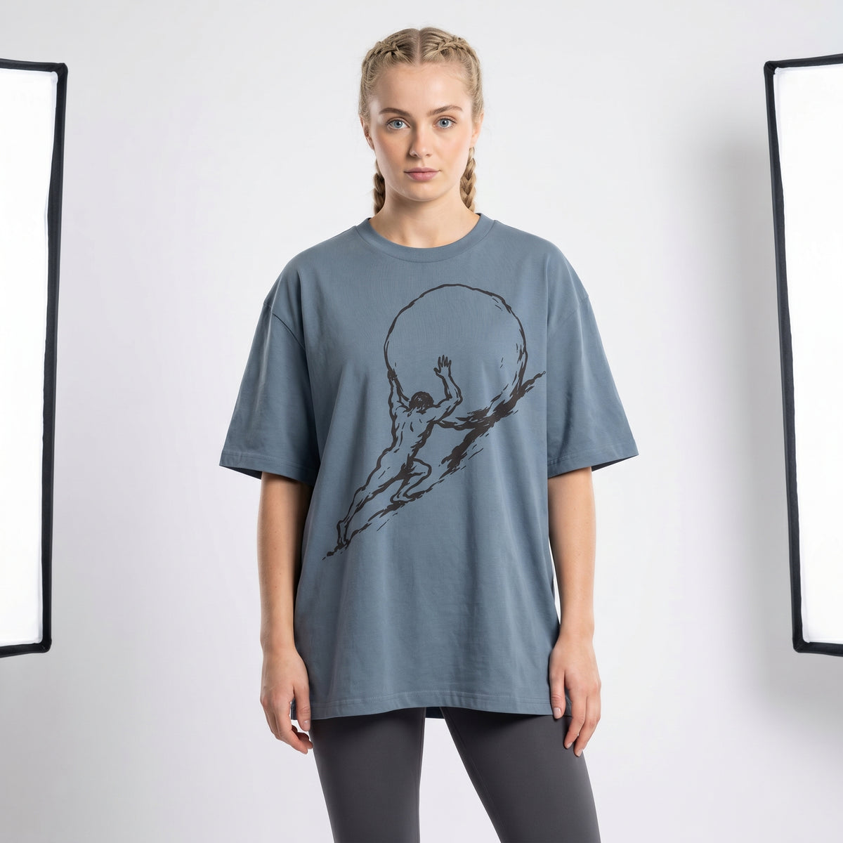 Woman wears a Sisyphus Garment Dyed Organic Graphic T-Shirt