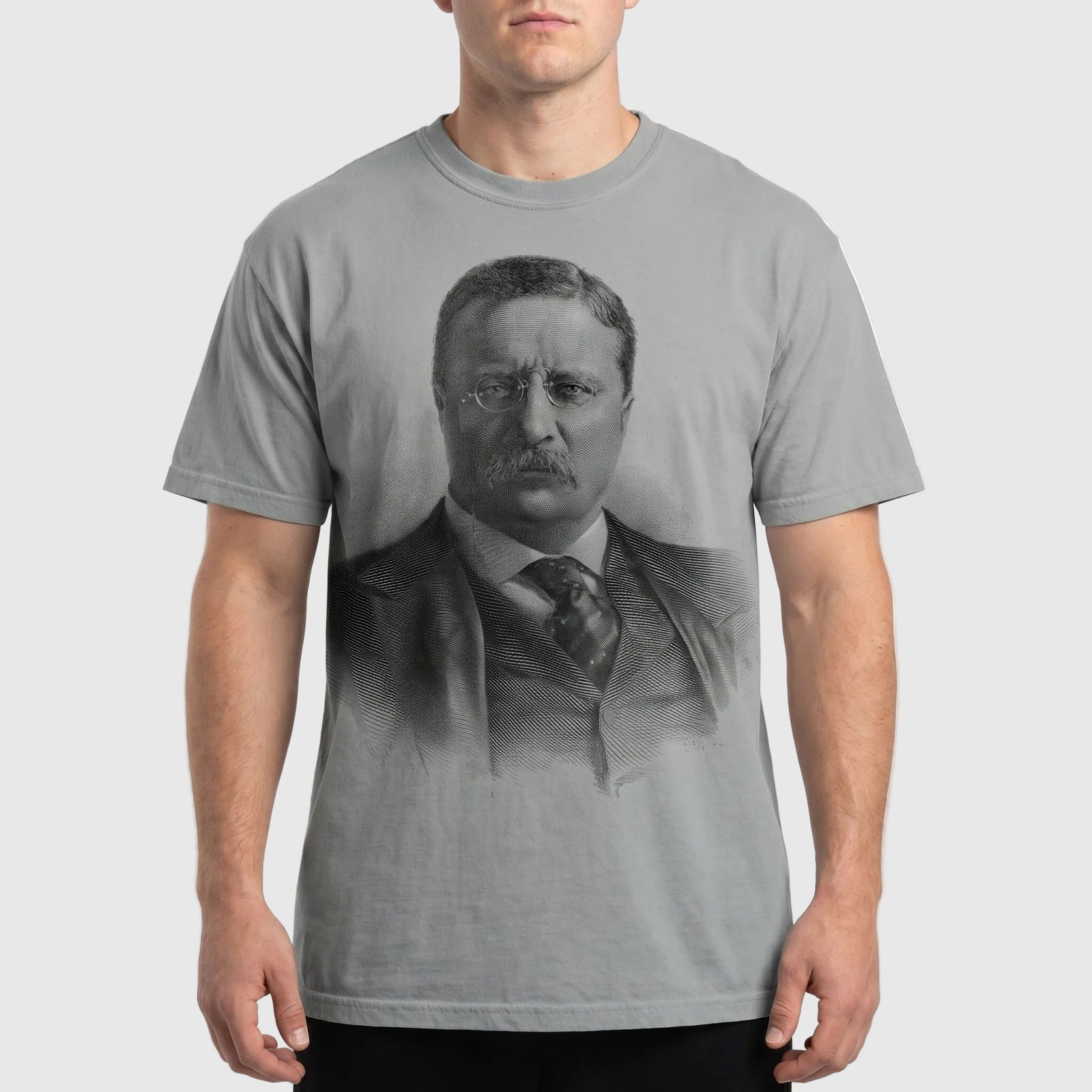Person wearing a t-shirt with a printed design of a historical figure.