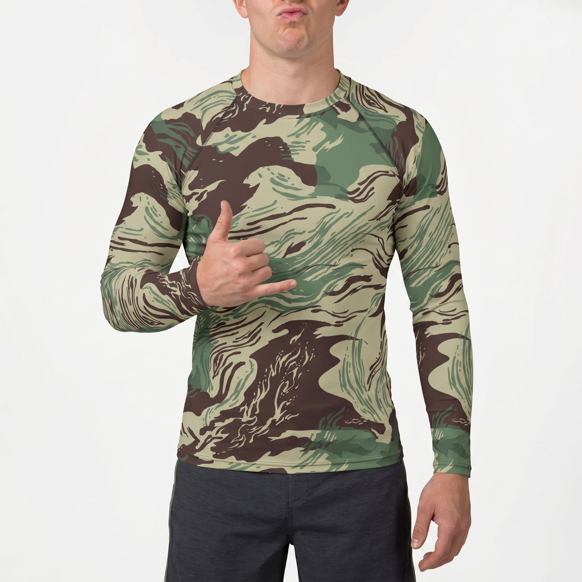 Person wearing a camouflage long-sleeve shirt on a white background