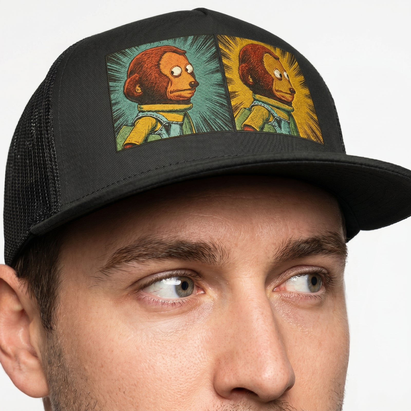 Black trucker cap with colorful graphic design on a white background