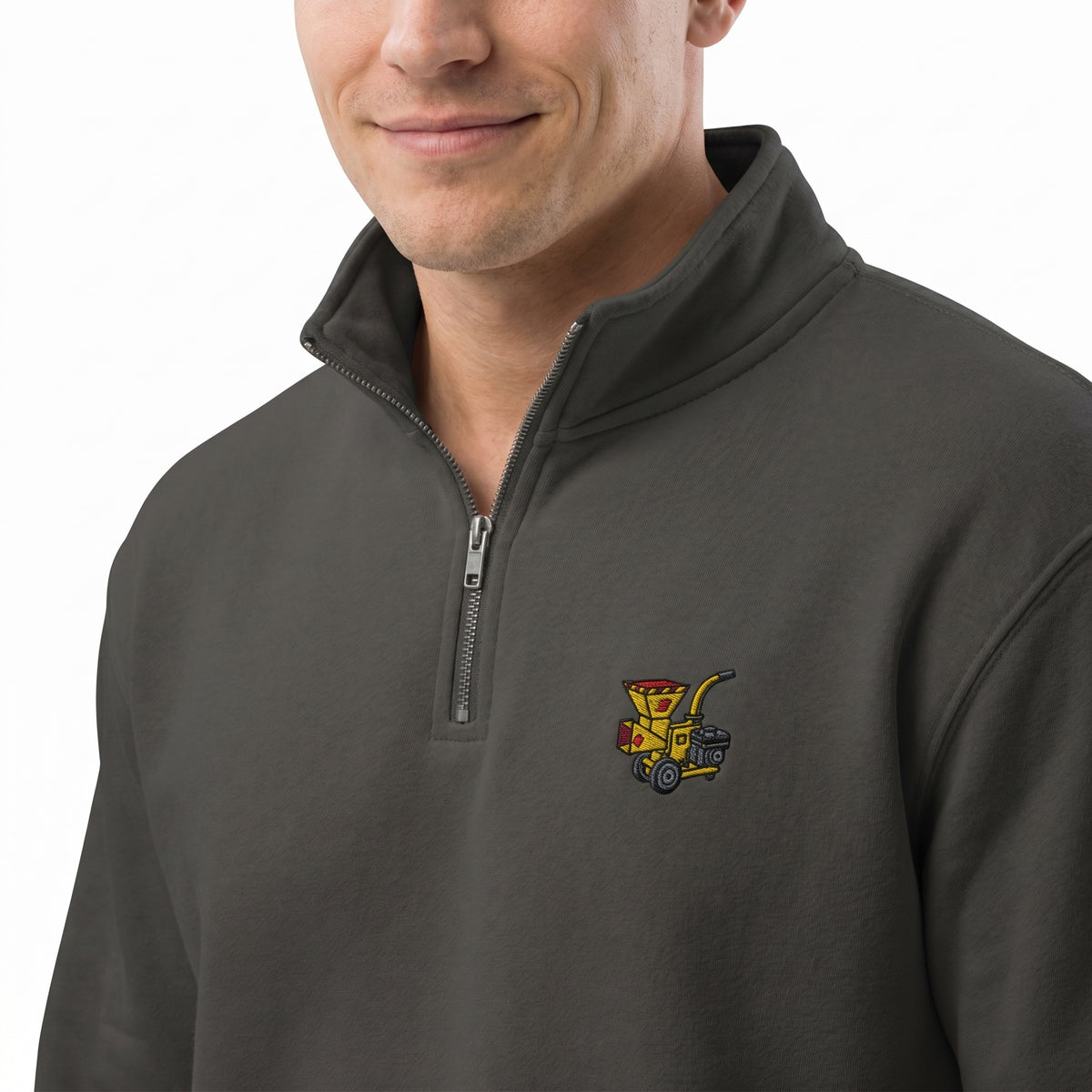 Man wearing a dark gray pullover with a colorful woodchipper logo on a white background