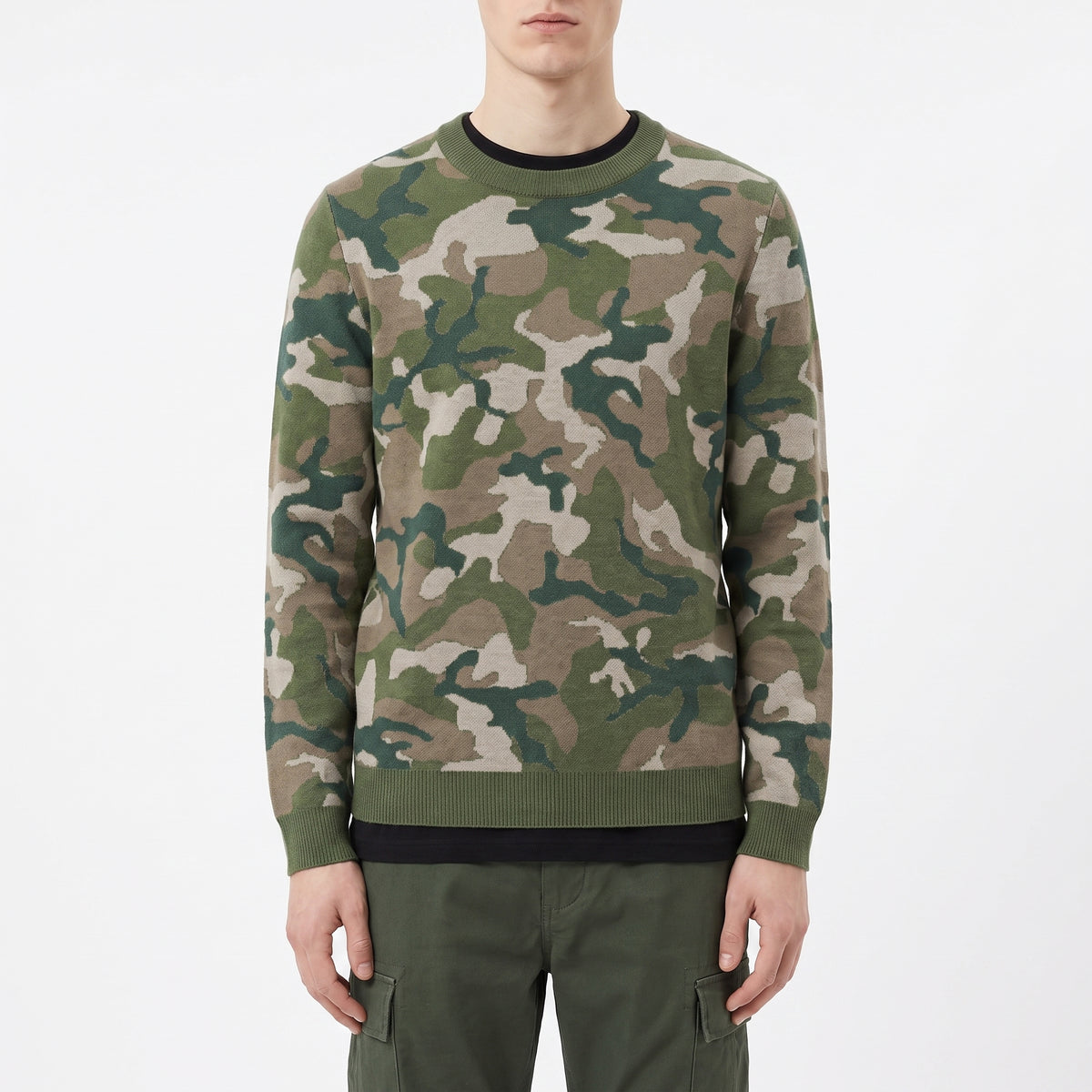 Person wearing a camouflage sweater on a white background
