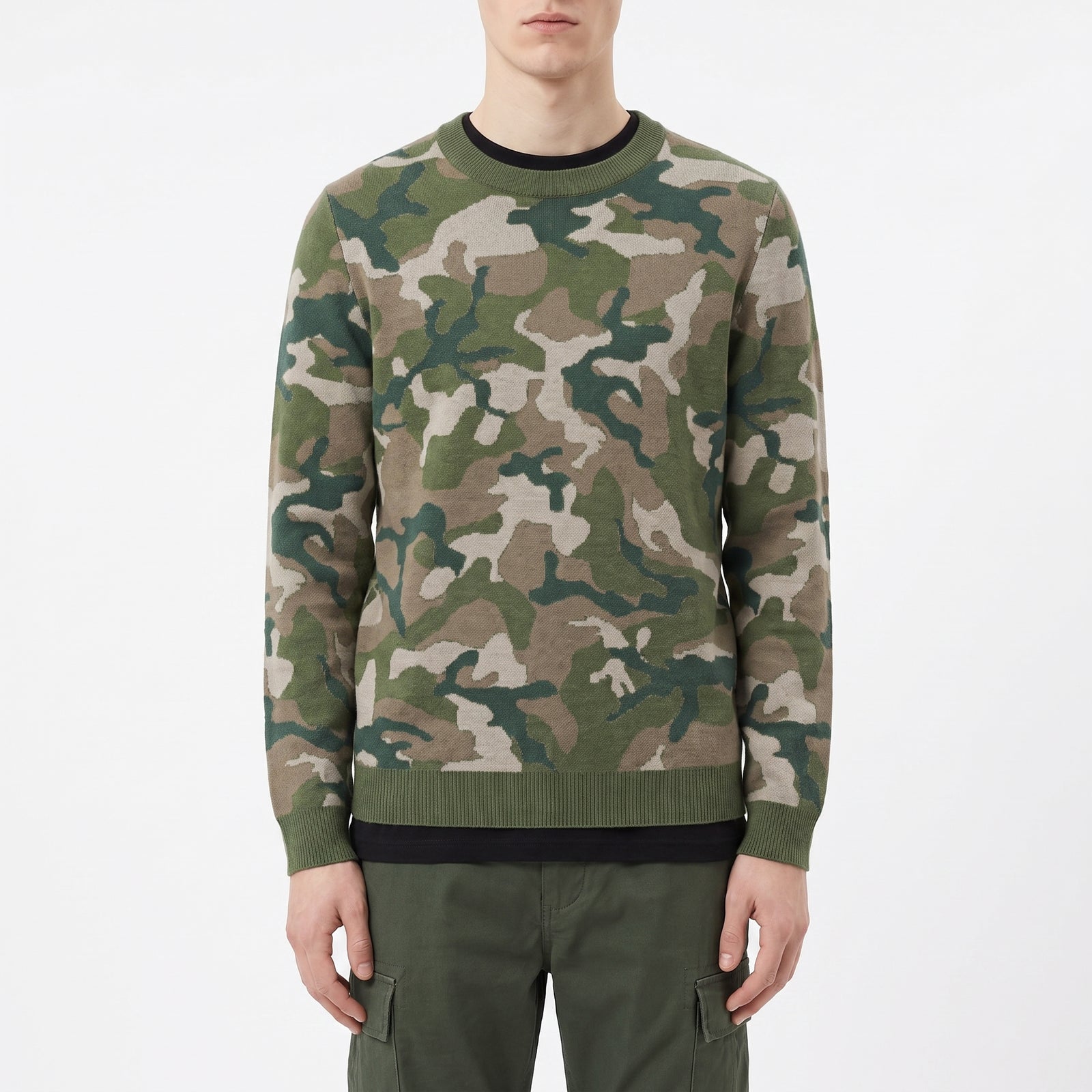 Person wearing a camouflage sweater on a white background
