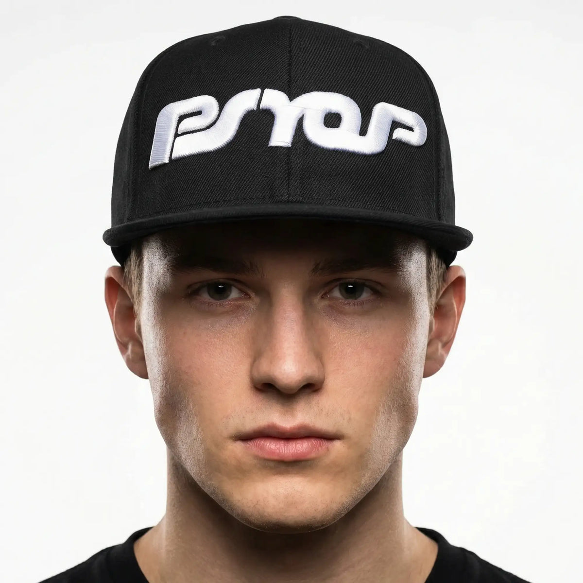 Person wearing a black cap with a logo on a white background