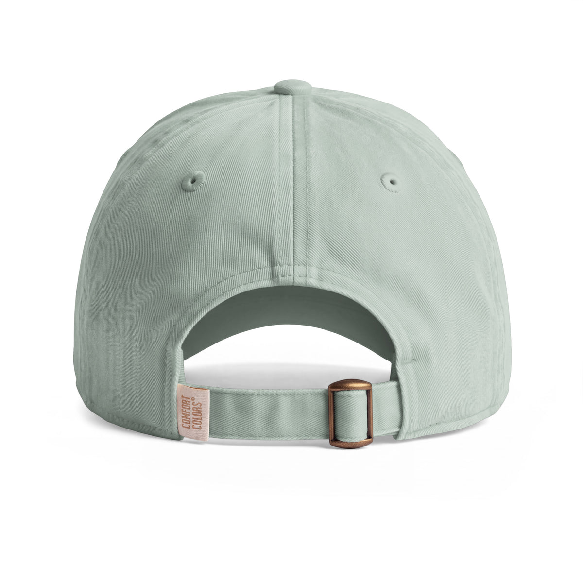 Bison sunwashed cotton cap in Bay, rear view showing the adjustable fabric strap and metal slider