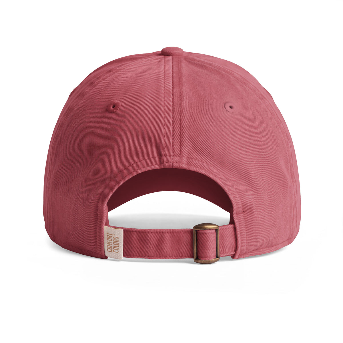 Bison sunwashed cotton cap in Crimson, rear view showing the adjustable fabric strap and metal slider