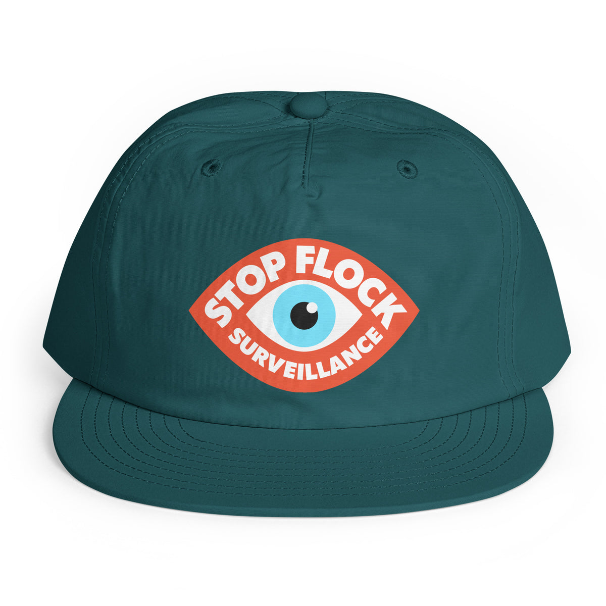 A dark teal baseball cap with a flat brim, featuring a red and white graphic on the front that reads 'STOP FLOCK SURVEILLANCE' around a blue and white eye illustration.