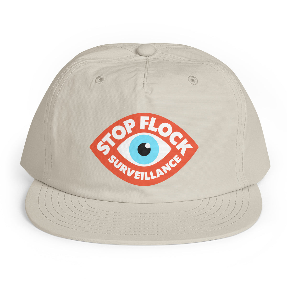 A light beige baseball cap with a curved brim, featuring a red graphic on the front with a blue eye and the text 'STOP FLOCK SURVEILLANCE'.