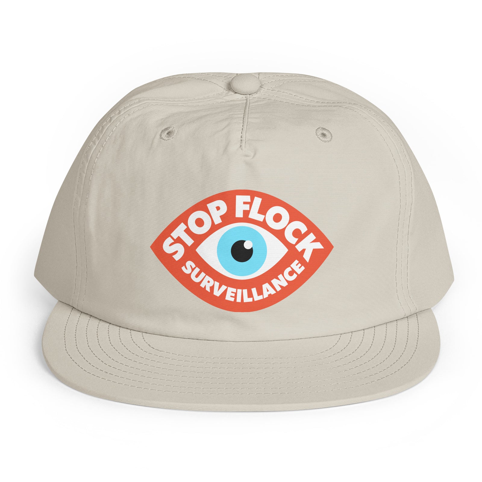 A light beige baseball cap with a curved brim, featuring a red graphic on the front with a blue eye and the text 'STOP FLOCK SURVEILLANCE'.