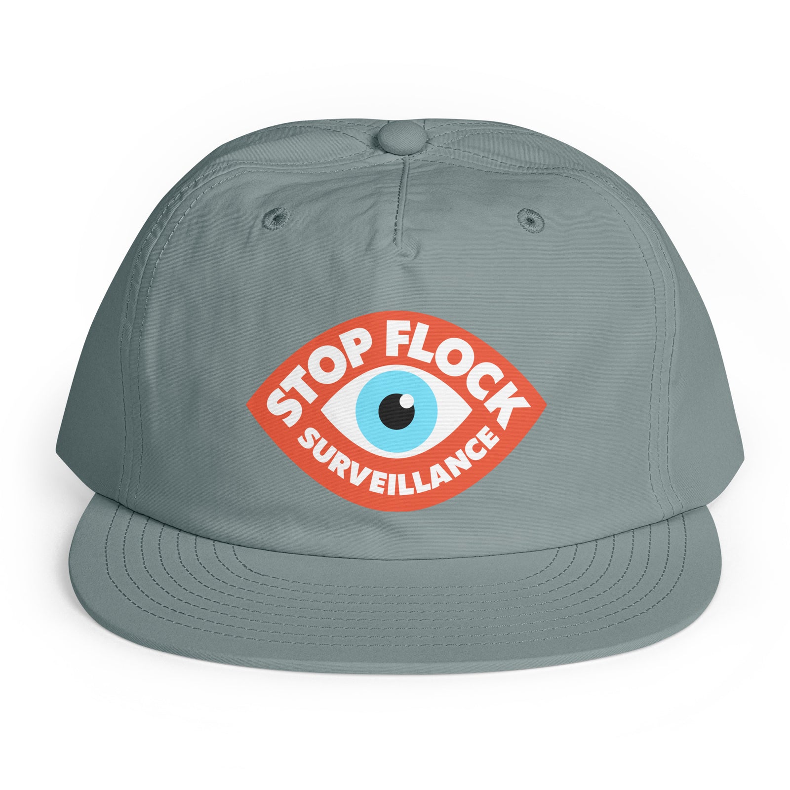 A gray snapback cap featuring a red, white, and blue graphic on the front with the text 'STOP FLOCK SURVEILLANCE' surrounding an eye illustration, set against a plain white background.