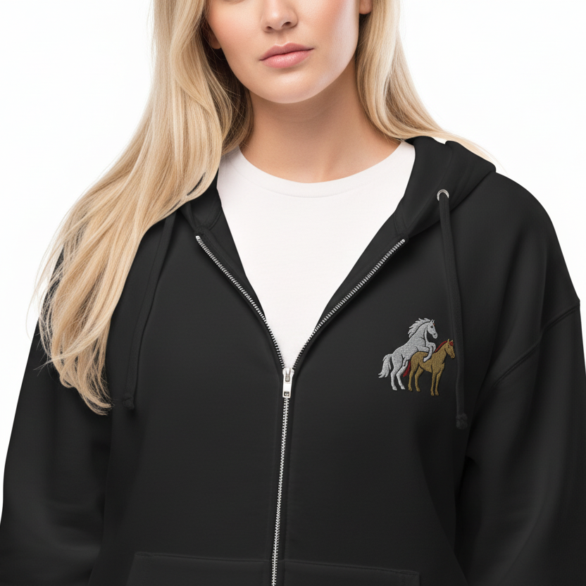 Person wearing a black hoodie with horse embroidery on a white background