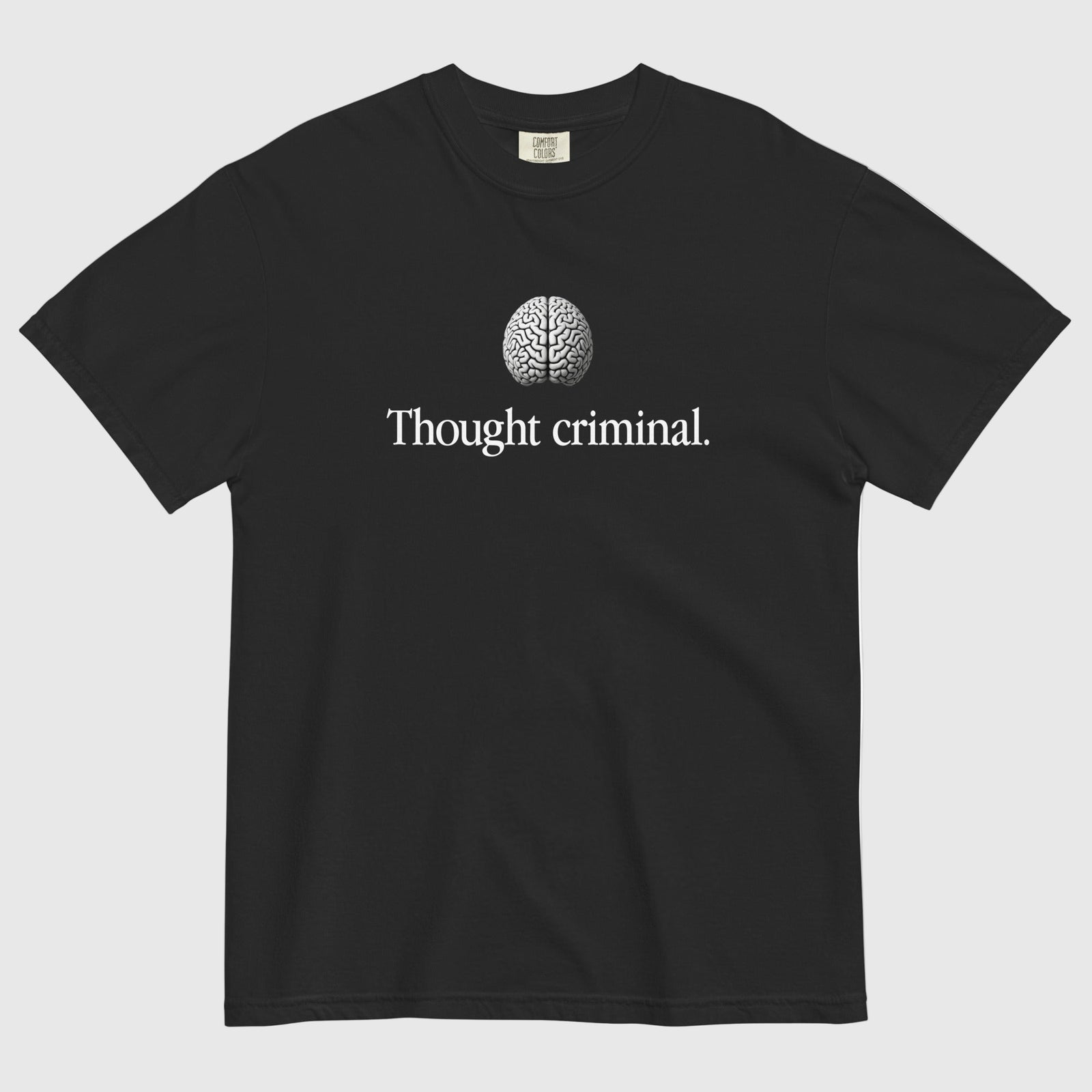 A man wearing a Thought Criminal parody shirt showing a words Thought Criminal with a brain above from Liberty Maniacs.