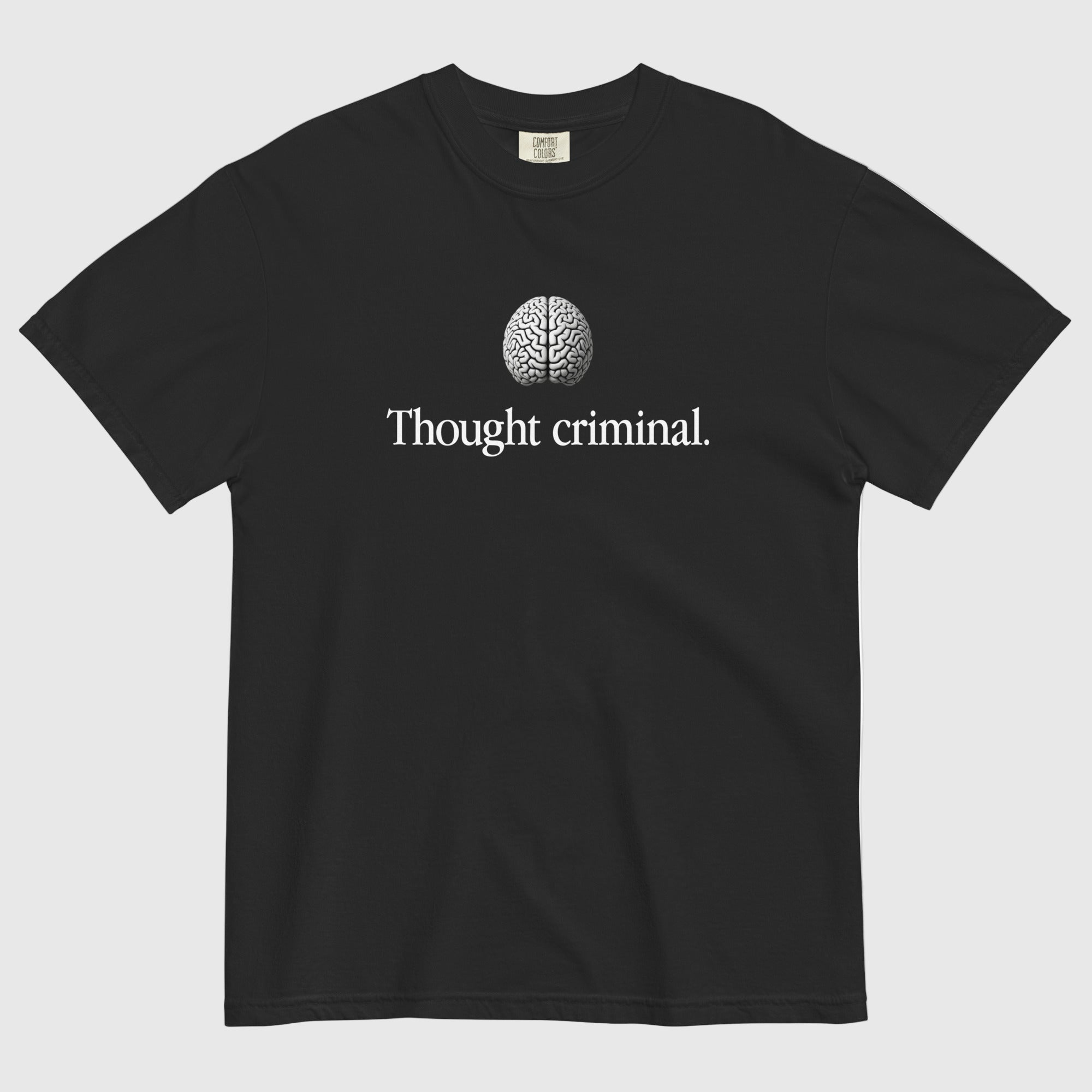 A man wearing a Thought Criminal parody shirt showing a words Thought Criminal with a brain above from Liberty Maniacs.