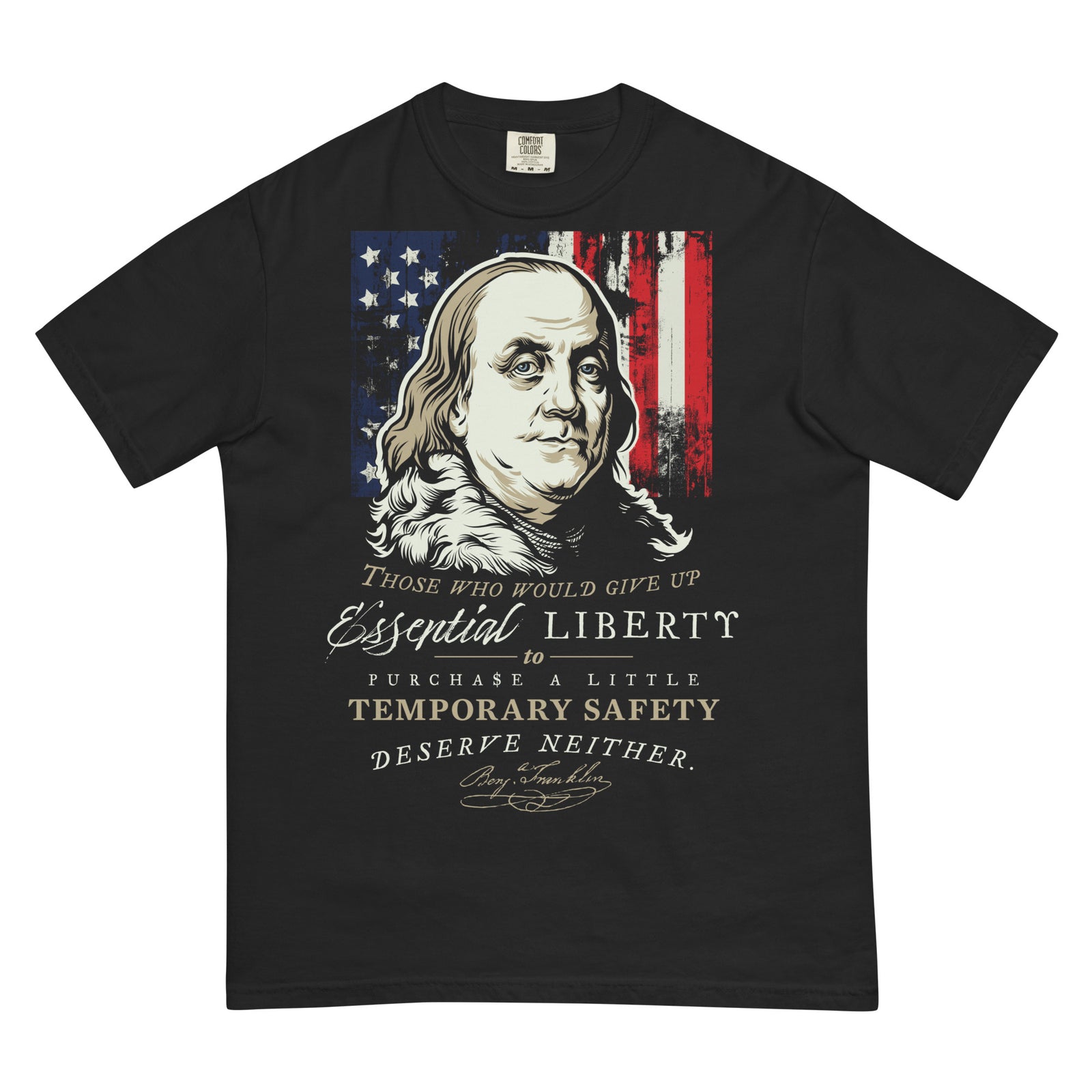 A black short-sleeve t-shirt featuring a graphic print of Benjamin Franklin's portrait over a distressed American flag, with the text 'Those who would give up Essential Liberty to purchase a little temporary safety deserve neither.'.