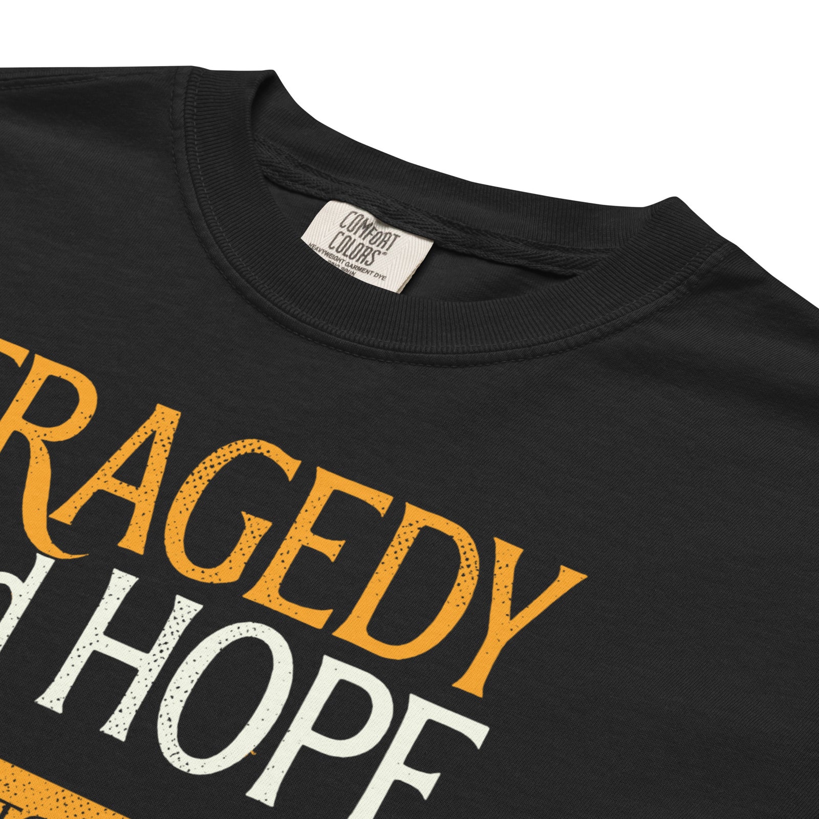 Laid-flat Tragedy and Hope tee displaying garment-dyed texture and relaxed fit.