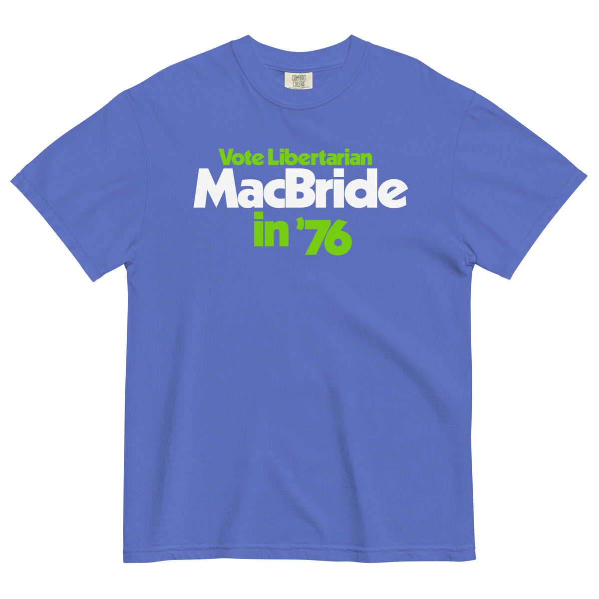 A royal blue short-sleeve t-shirt with a graphic print reading 'Vote Libertarian MacBride in '76' in white and lime green text, displayed flat against a white background.