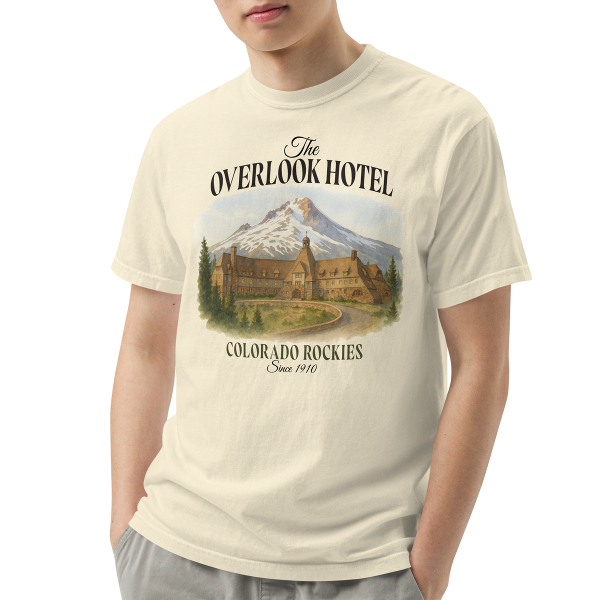 Person wearing a t-shirt with &#39;The Overlook Hotel&#39; design on a white background