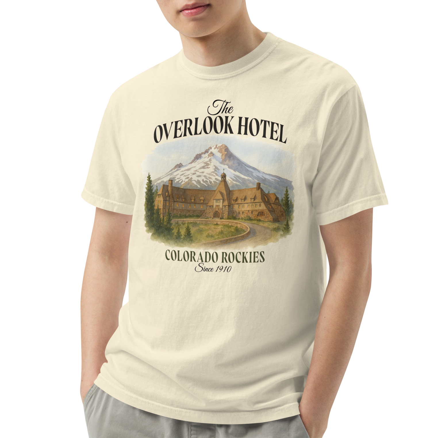 Person wearing a t-shirt with 'The Overlook Hotel' design on a white background
