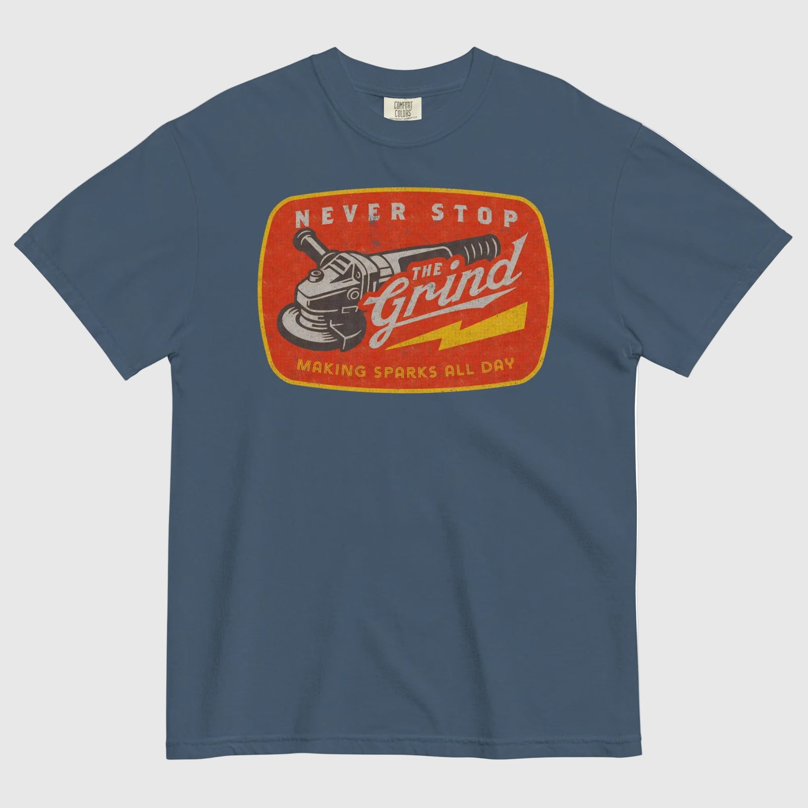 Blue t-shirt with a graphic design featuring a grinder and text on a white background