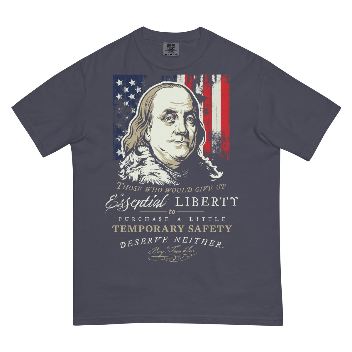 A dark slate blue-gray t-shirt featuring a graphic print of Benjamin Franklin's portrait over an American flag, with the text 'Those who would give up Essential Liberty to Purchase a Little Temporary Safety Deserve Neither.'.