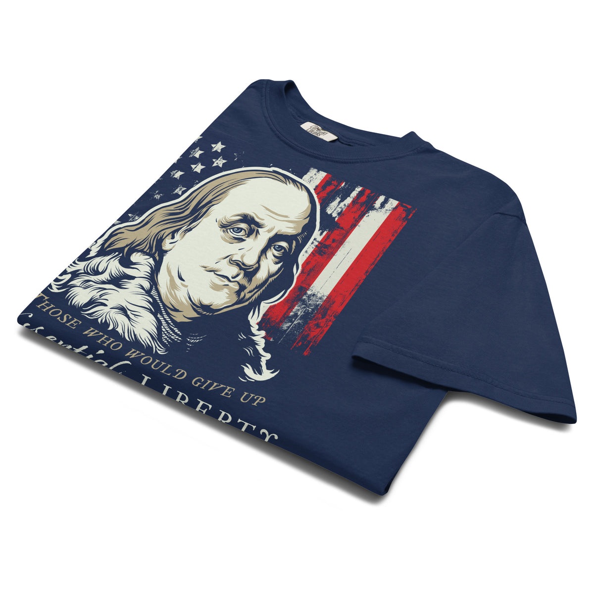 A navy blue short-sleeve t-shirt with a graphic print of Benjamin Franklin's portrait, an American flag motif, and the text 'THOSE WHO WOULD GIVE UP the spirit of liberty'. The shirt is displayed on a clean white background.