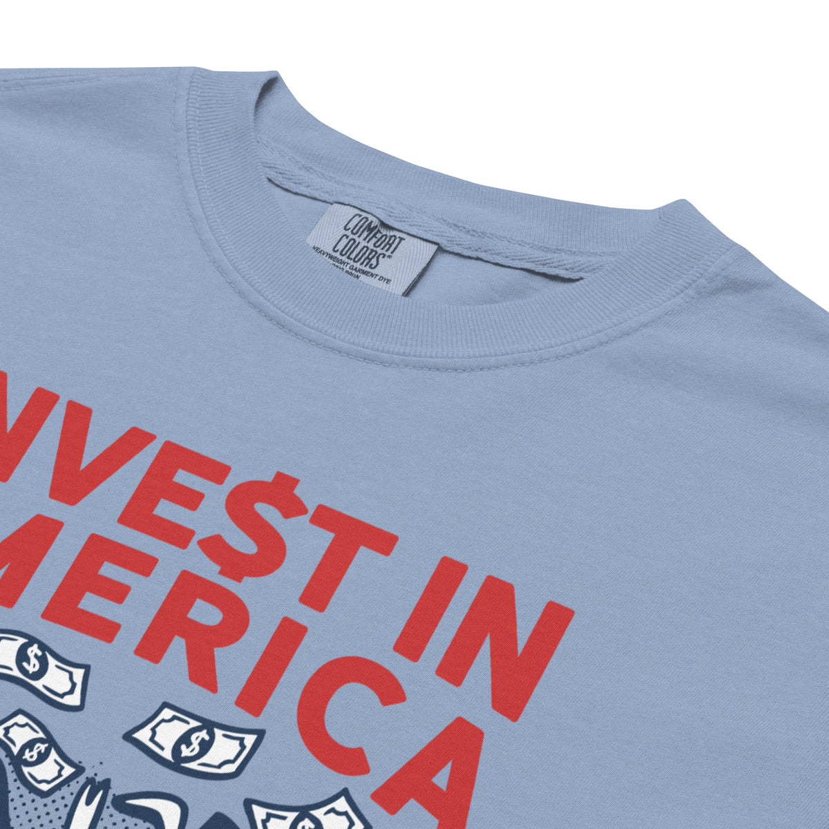 Blue t-shirt with red text &#39;VEST IN AMERICA&#39; and dollar signs on a white background