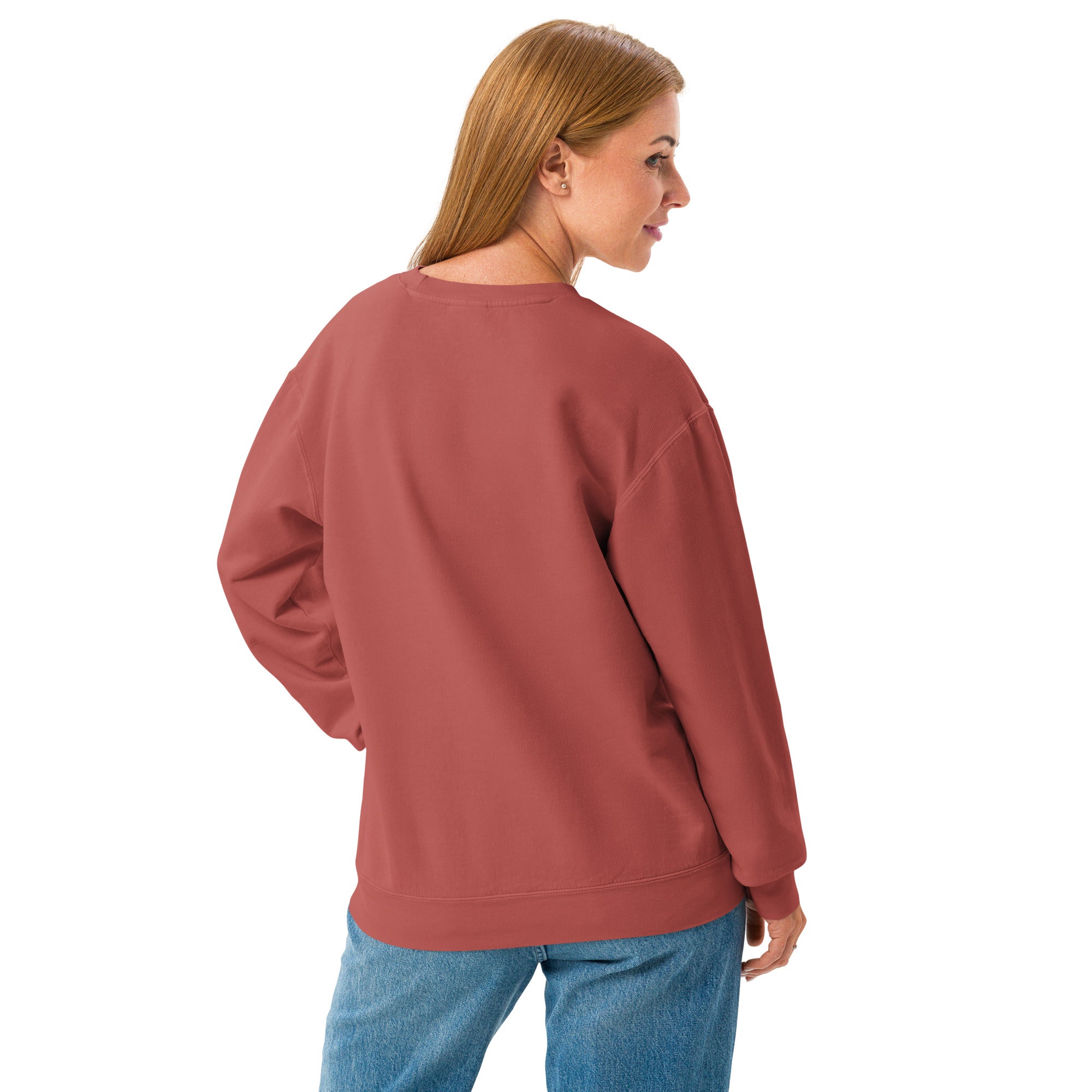 Person wearing a red sweatshirt and blue jeans on a white background