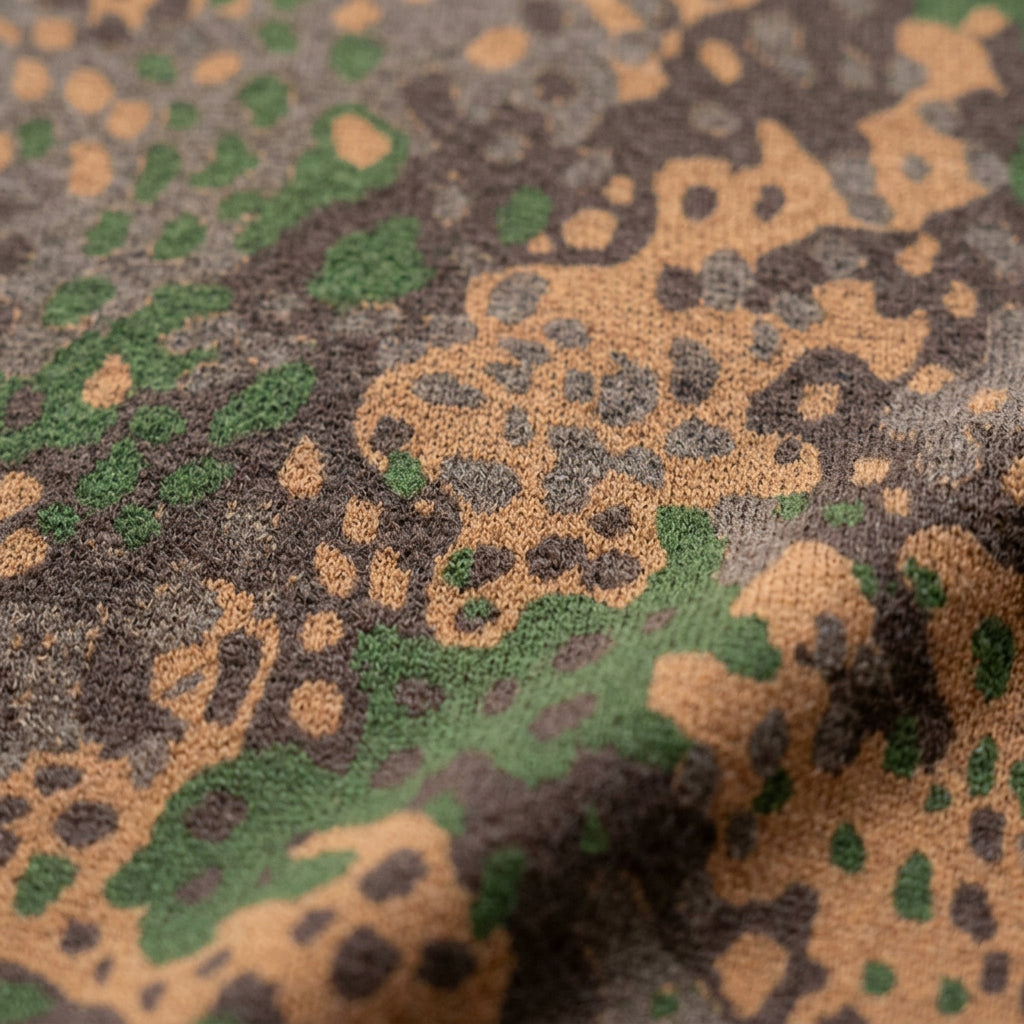 Erbsenmuster pea-pattern camo knit V-neck vest in green, brown, and tan, back view, size XL, showing all-over camouflage