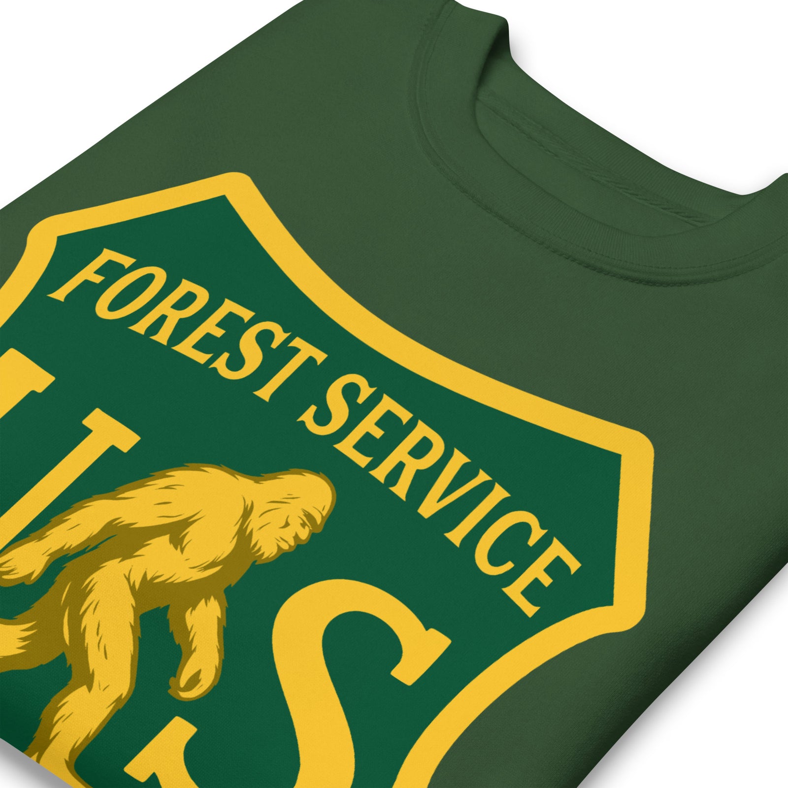 Green t-shirt with yellow 'Forest Service' logo featuring a bear illustration on a white background