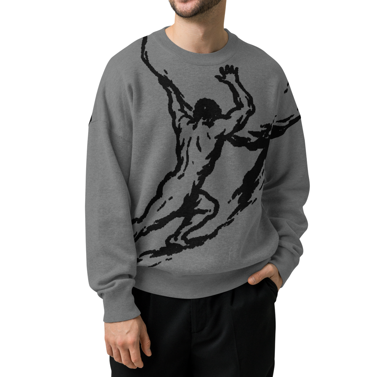 A man wearing a heather gray crewneck sweatshirt with a large black graphic of a dancing figure on the front, paired with black pants, set against a plain white background.