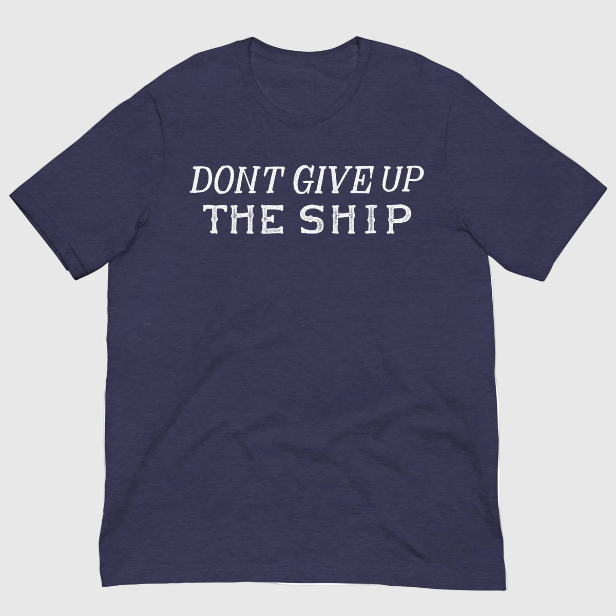 A navy blue heather short-sleeve t-shirt with the phrase 'DON'T GIVE UP THE SHIP' printed in white distressed block letters across the chest, displayed flat against a solid white background.