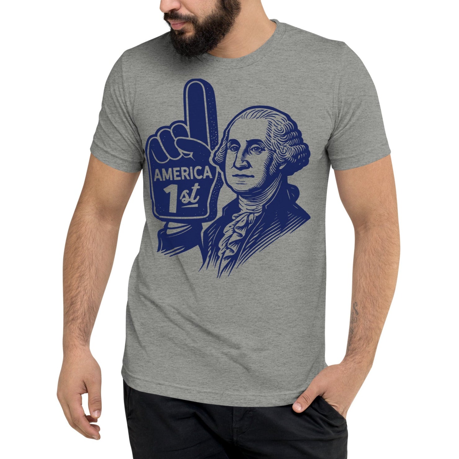 A t-shirt by Liberty Maniacs of George Washington with a foam number 1 finger that says America First in a retro illustrated style. And original shirt by Liberty Maniacs.