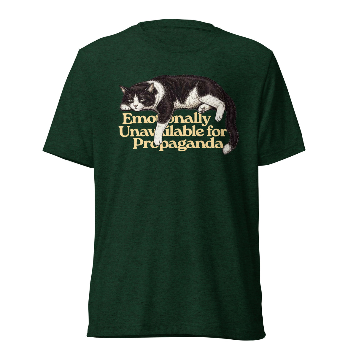 A dark green heathered t-shirt featuring a graphic of a black and white cat lying down with the text 'Emotionally Unavailable for Propaganda' in a gold serif font, shown against a plain white background.