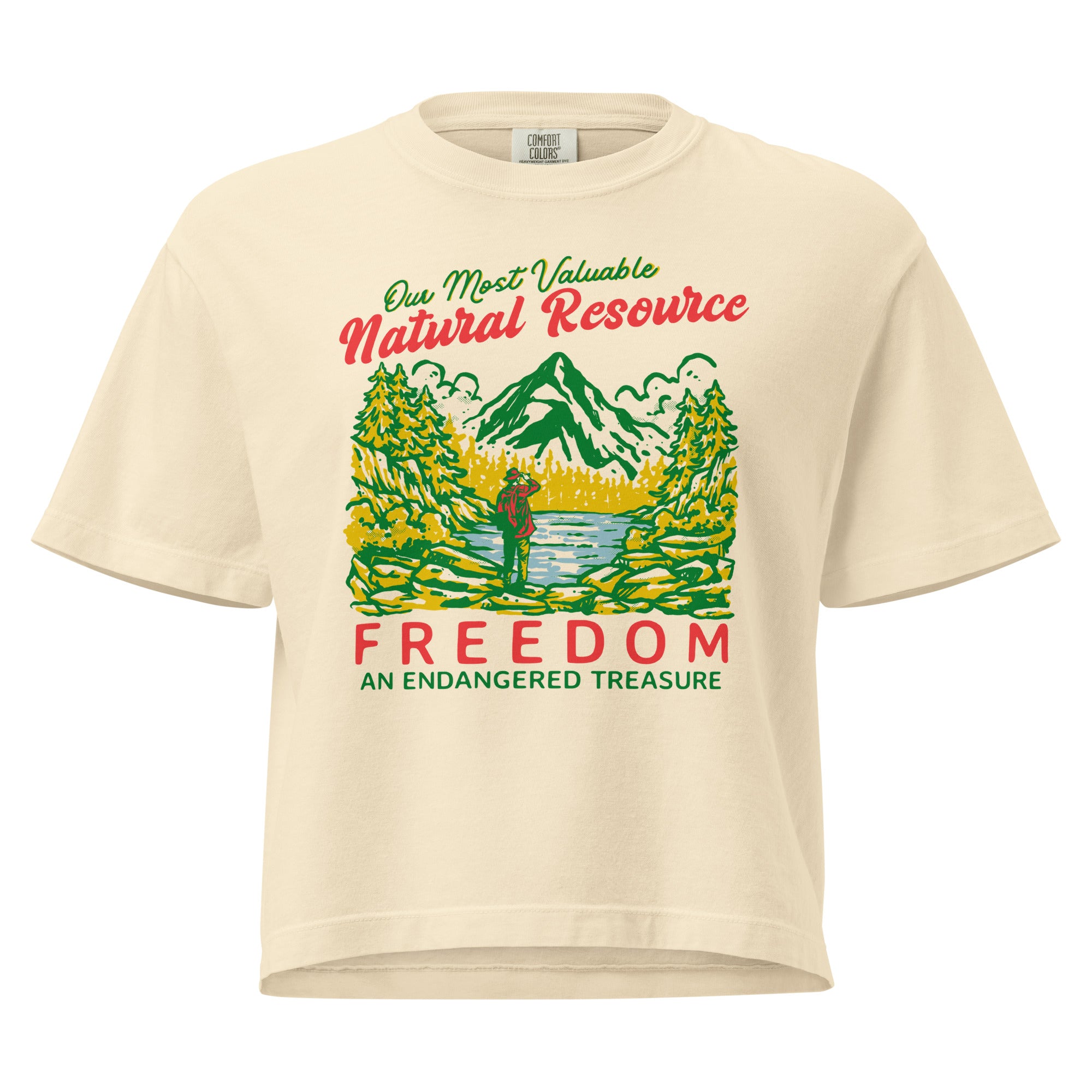 Beige t-shirt with nature-themed graphic and text on a white background