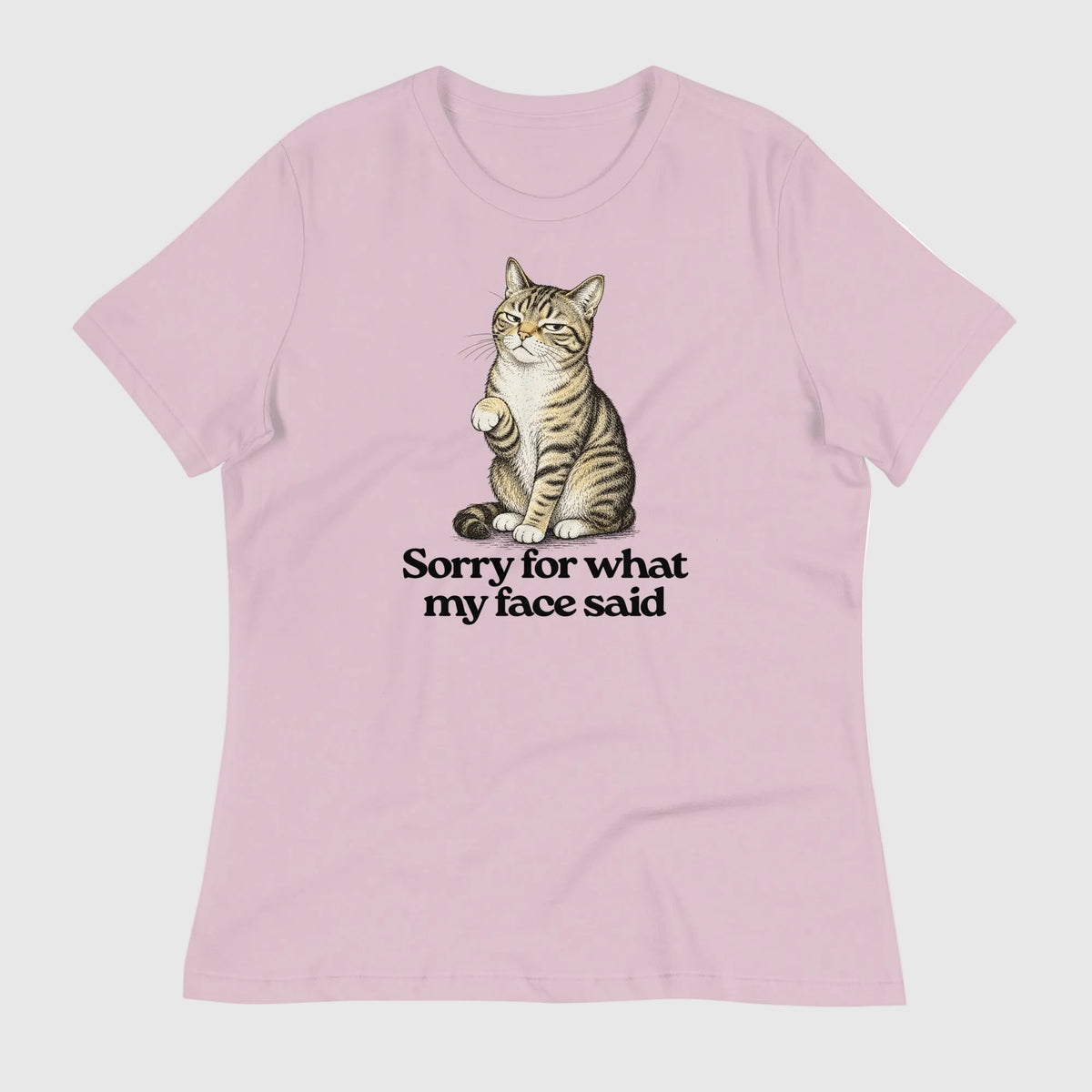 Pink t-shirt with a cat graphic and text on a white background