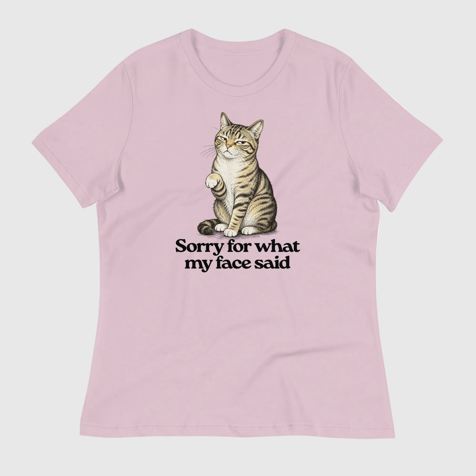 Pink t-shirt with a cat graphic and text on a white background
