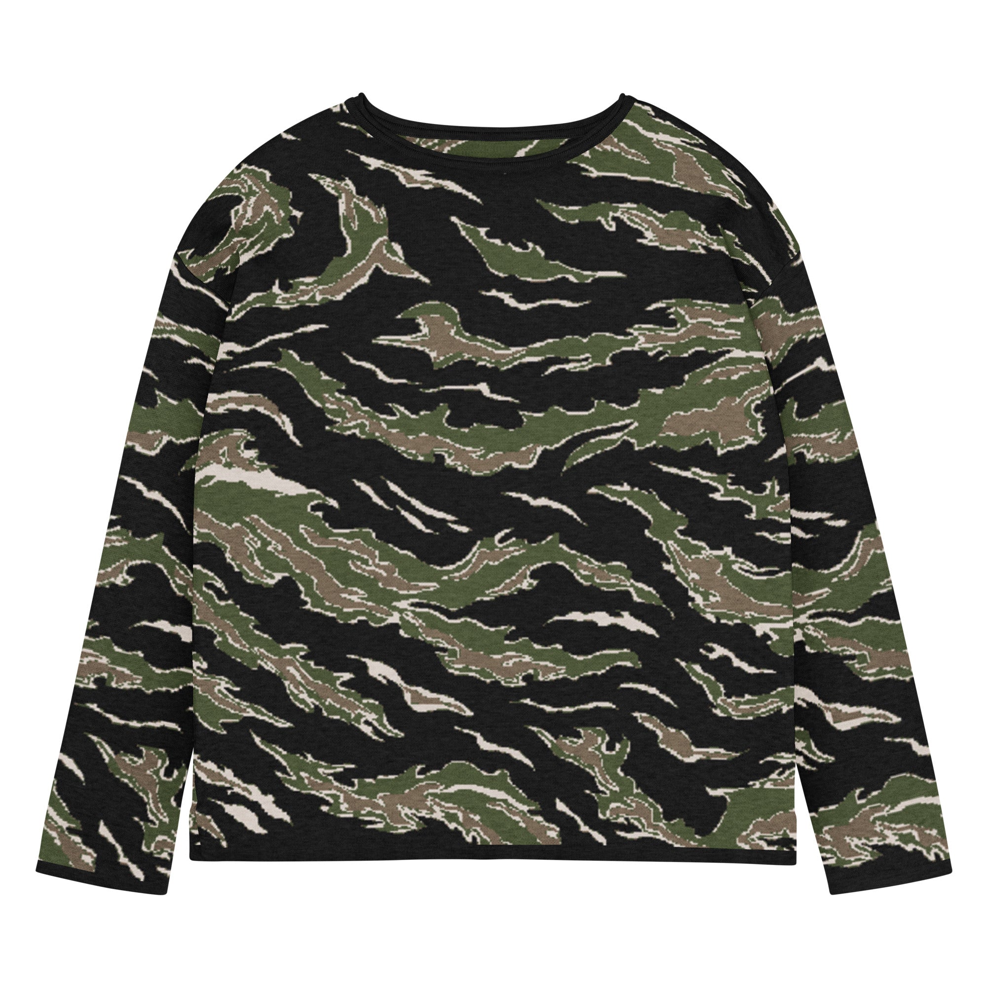 Woman wearing a camouflage sweater and green pants on a white background