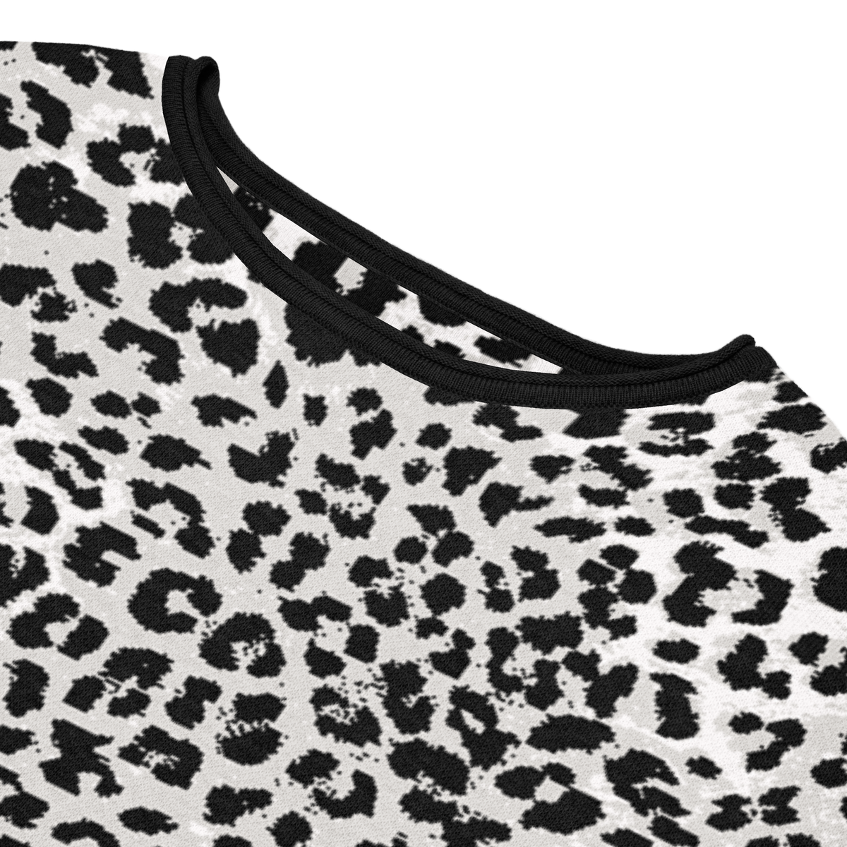 Close-up of a knit sweater with a leopard print pattern on a white background