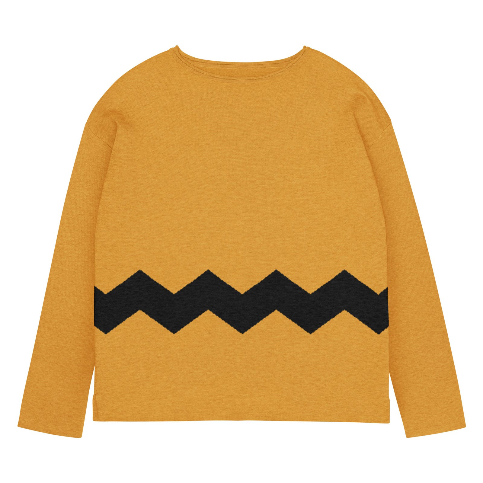 Woman wearing a mustard yellow sweater with a black zigzag pattern on a gray background